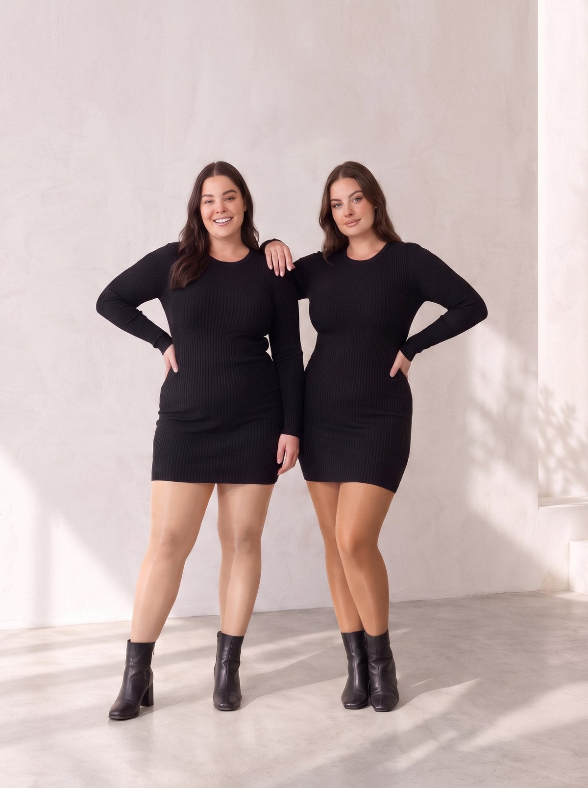 Two plus-size women in black mini dresses and skin-tone shaping fleece-lined tights